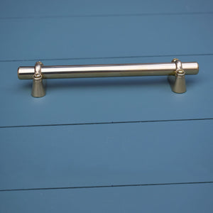 Solid Brass Bar Pull with Solid Brass Extenders on blue drawers