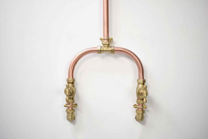 close up photo of the copper shower taps, shower mixer taps uk
