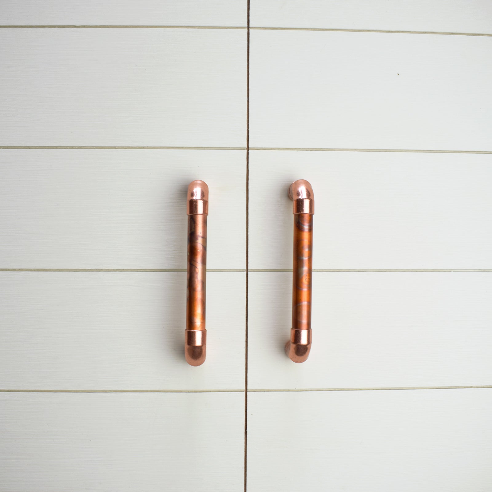 Copper Pull Handle - Marbled / High Polish Mix - On white cabinets