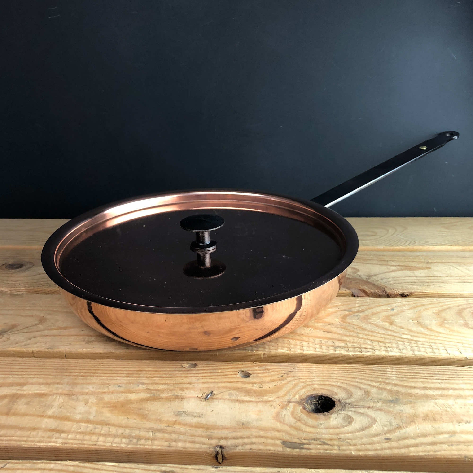 Copper frying pan from above with lid