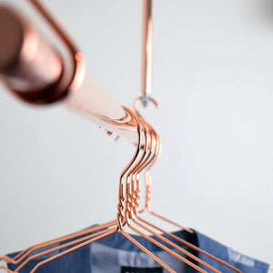 Hanging Copper Clothes Rail with copper clothes hangers