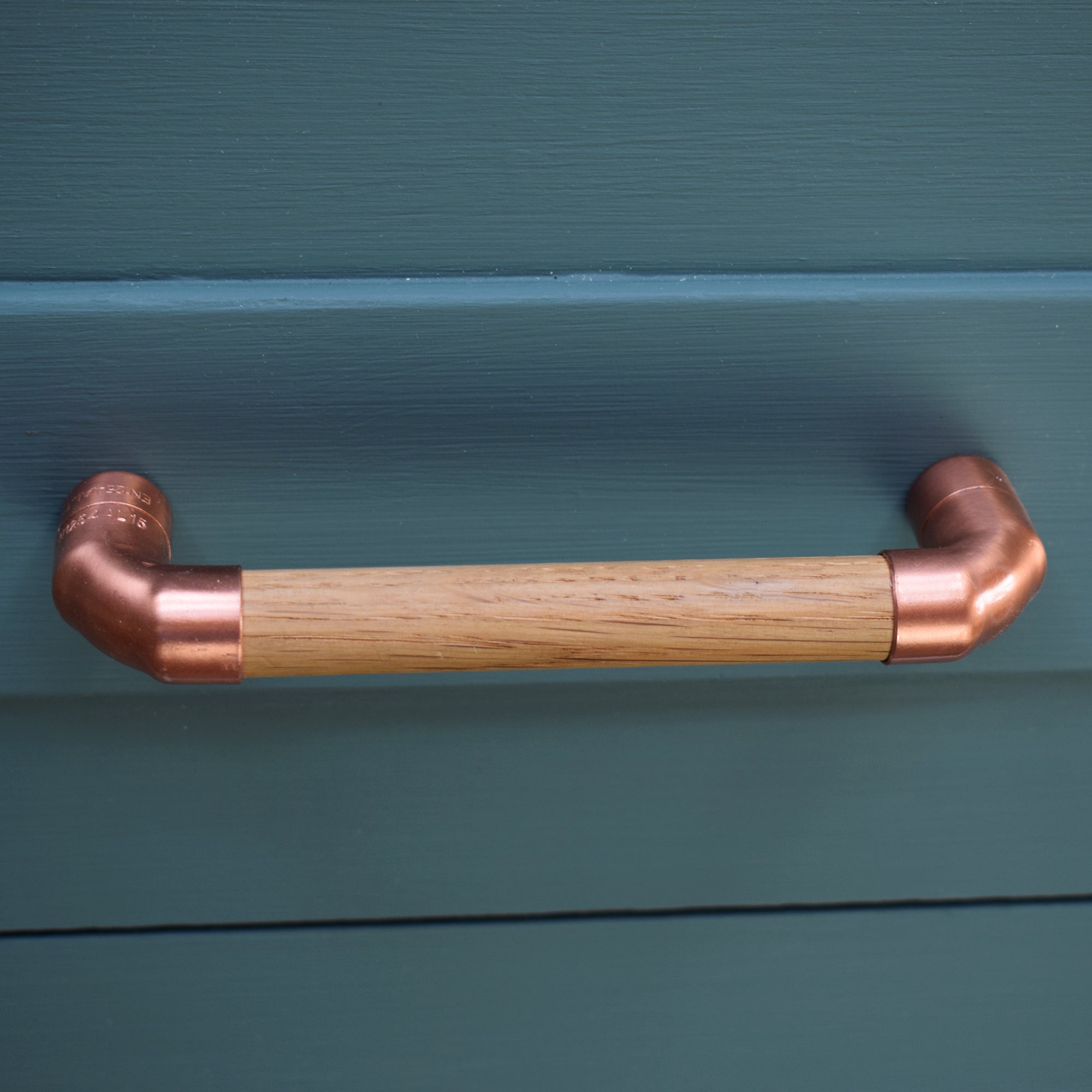 Copper Pull Handle with Oak T-shaped - On Blue Cabinets