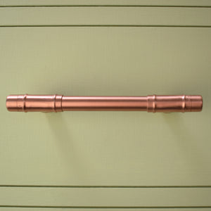 Copper Pull Handle T-shaped - Front Shot on Green Cabinet