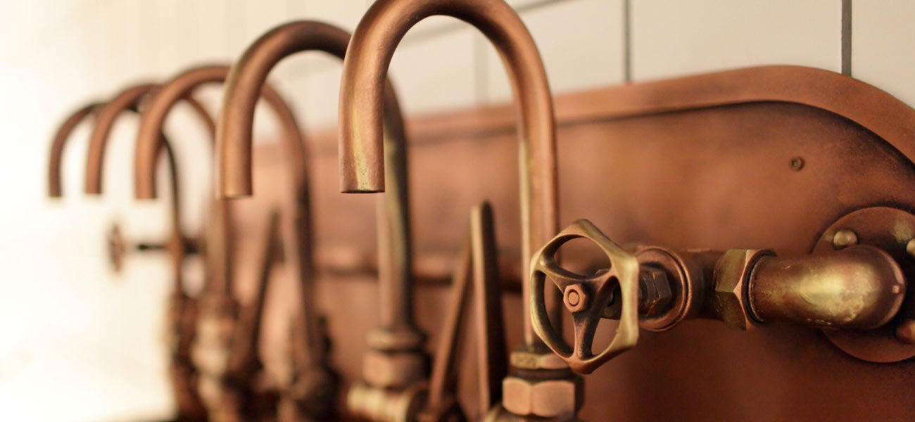 Row of solid copper taps 