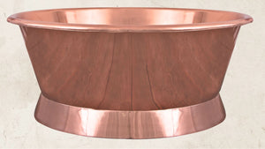 Copper bathtub on a beige background