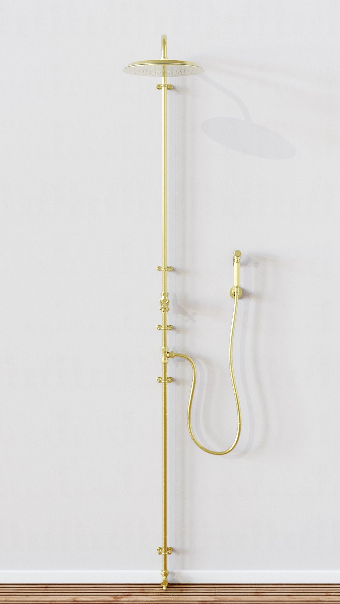 Brass shower on wall with trigger handset