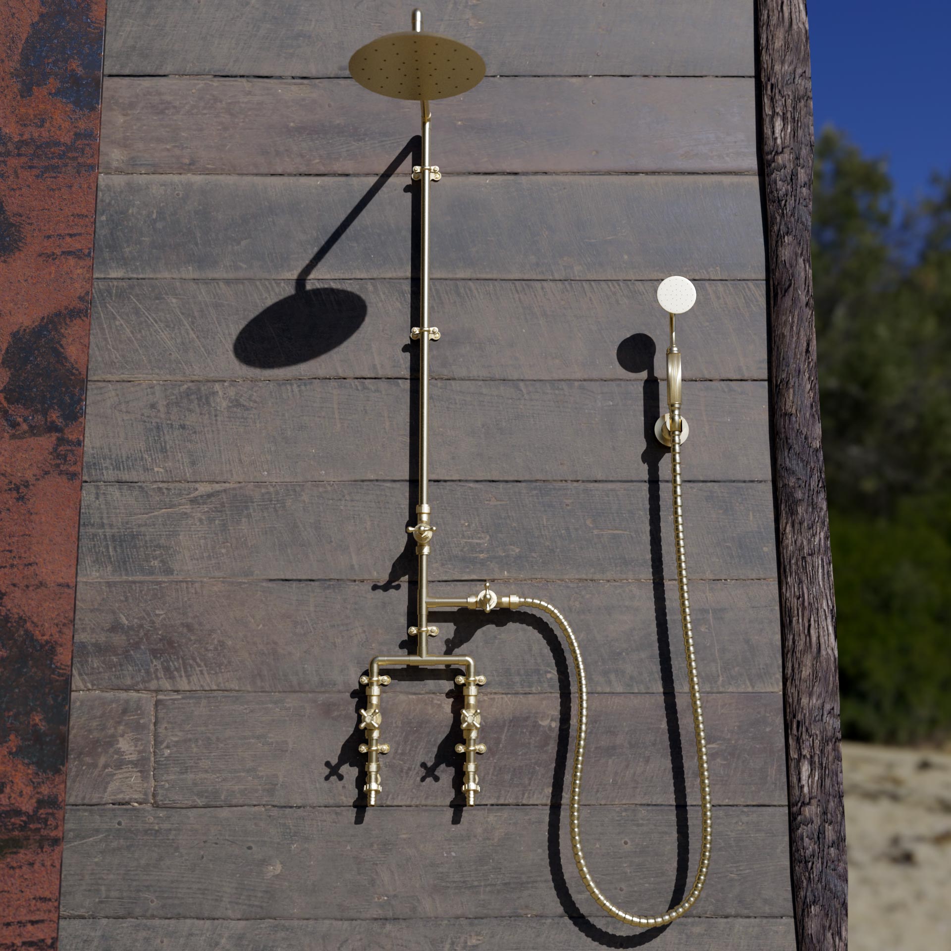brass shower on wooden boards on seafront