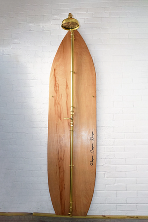 Brass shower on wood surfboard front view