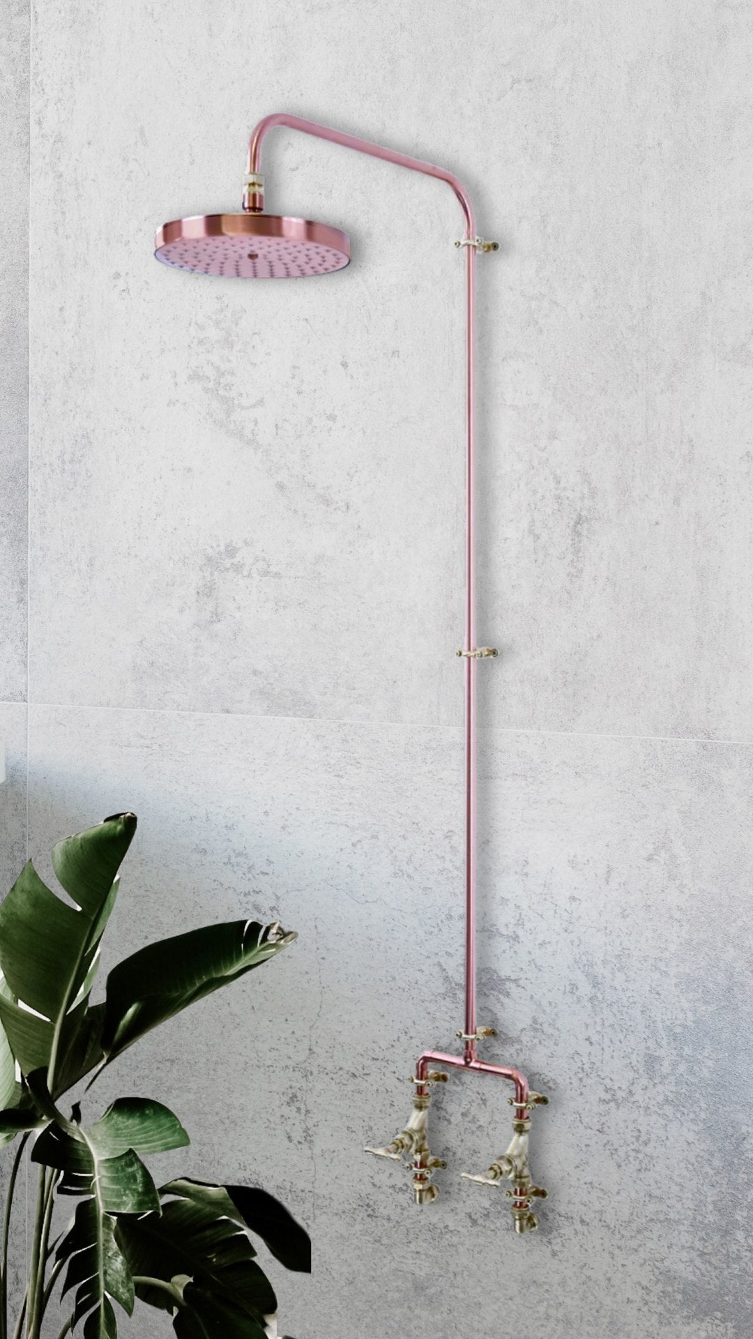 Copper mixer shower photographed in a luxury spa resort on a concrete background