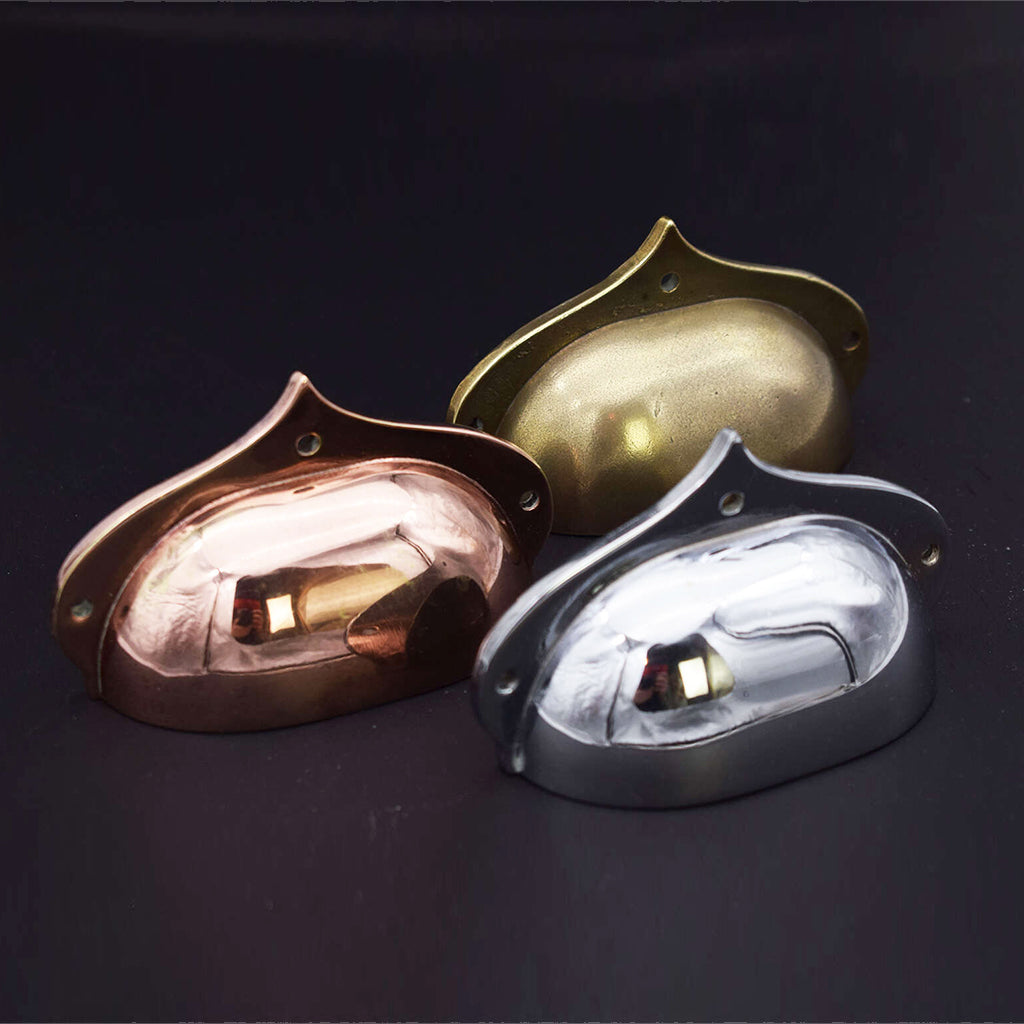 Range of cup handles in copper, chrome and brass