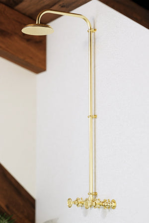 Brass shower in farmhouse setting