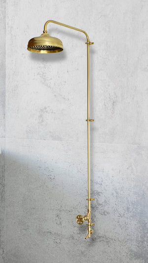 brass cold shower on a concrete wall background