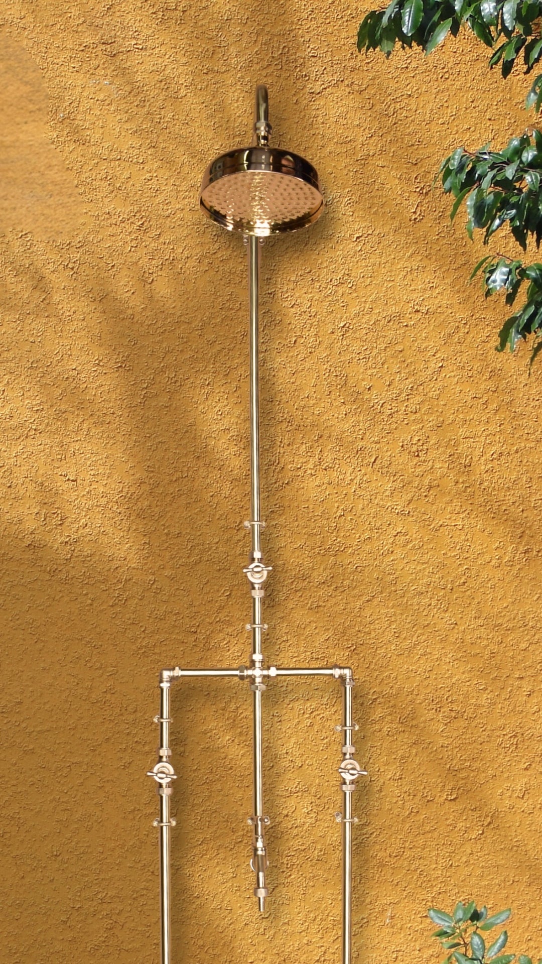 brass shower in back garden with garden tap
