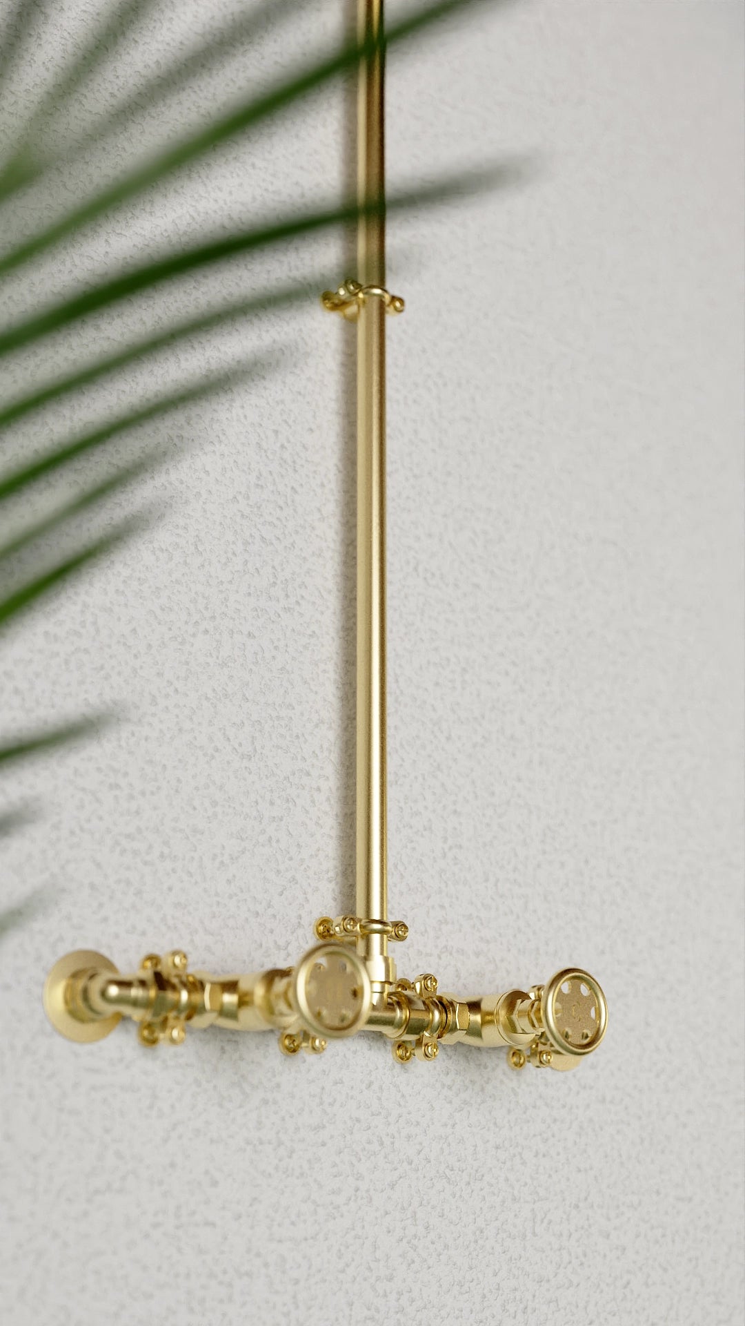 Brass shower in farmhouse setting close up