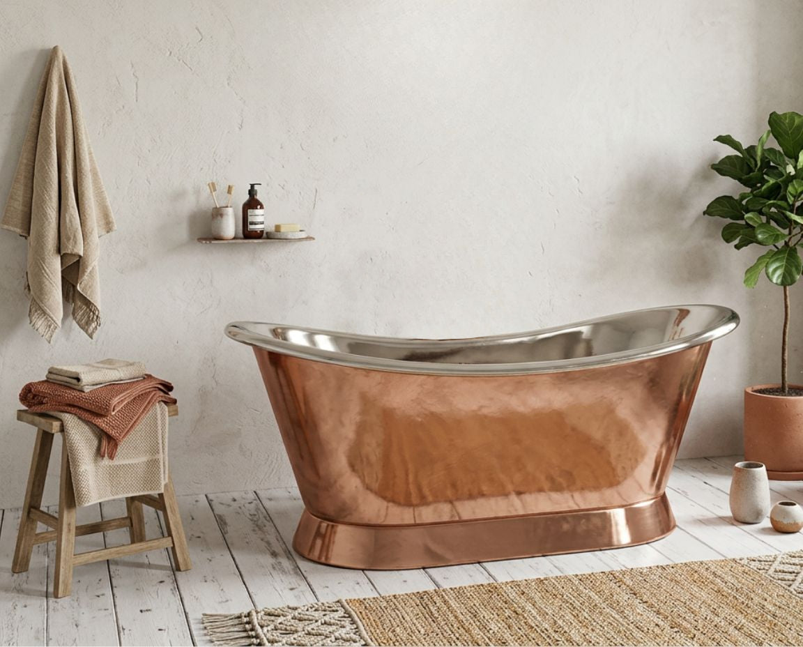 Copper bathtub in a bathroom with a plant and stool.