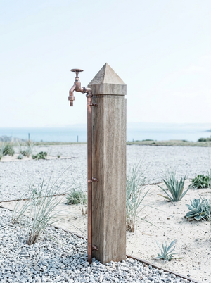 Wooden post with a garden faucet  exterior copper tap
