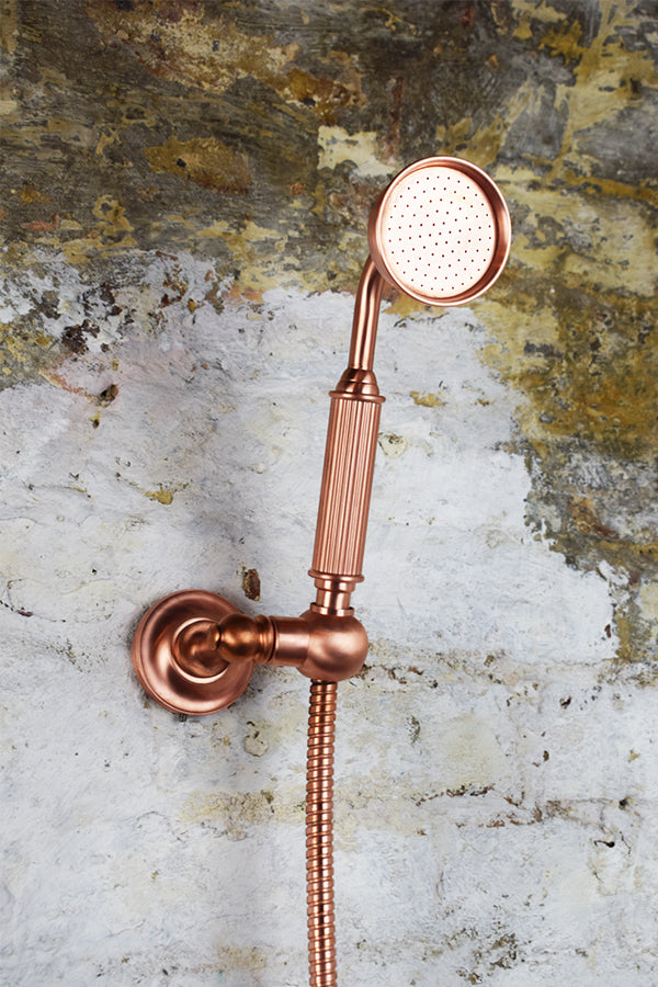 close up of copper mixer handheld shower