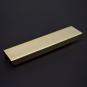 folded brass handle angled view