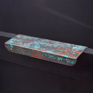 Verdigris copper folded handle on drawer