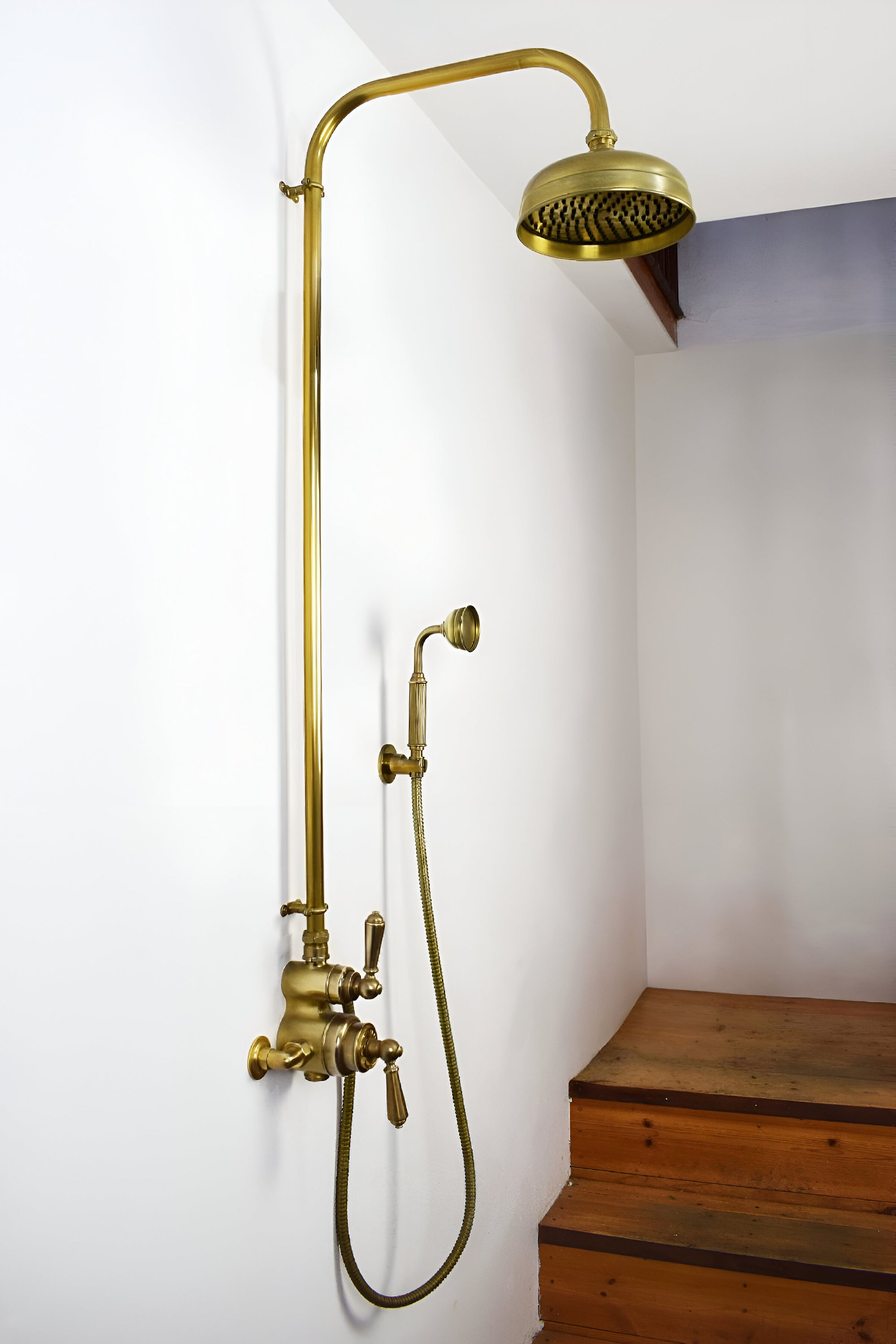 Brass thermostatic shower on wall in Brighton showroom