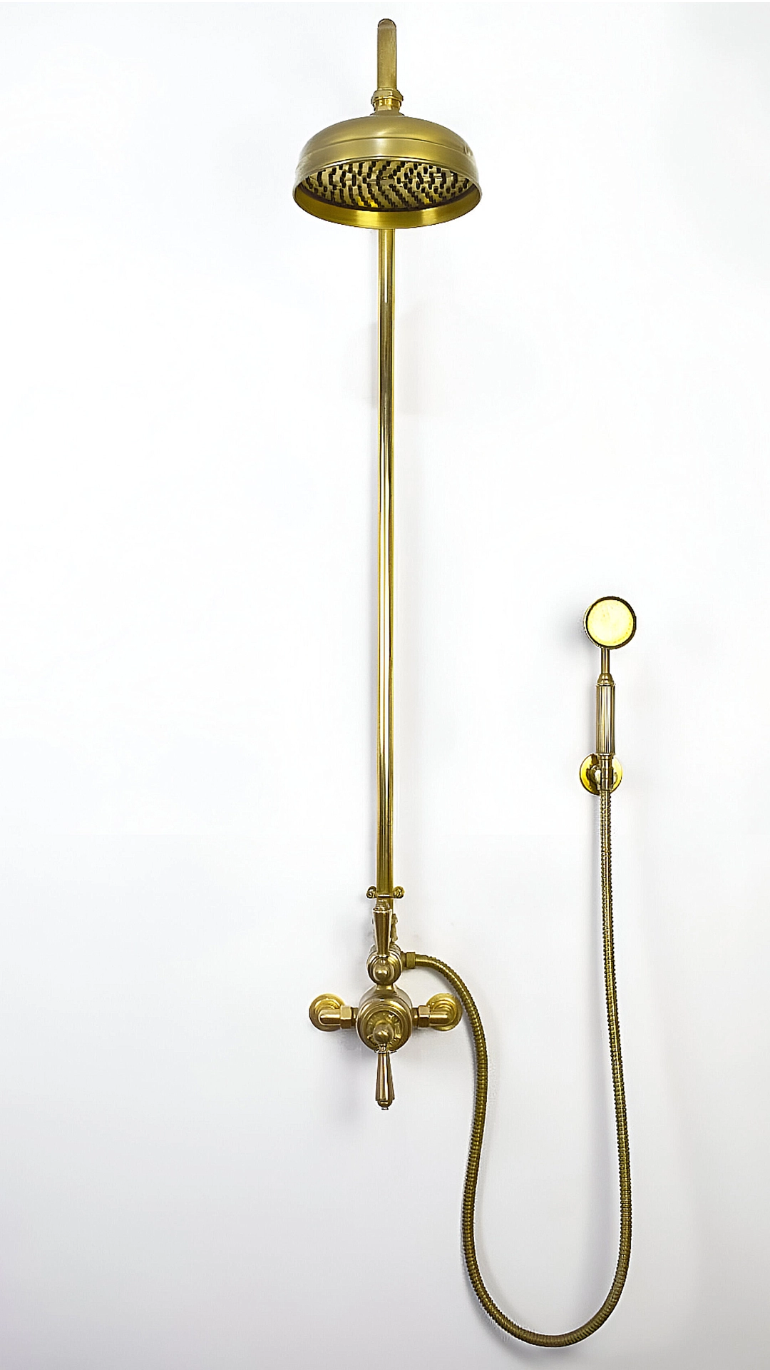 Front view of a brass thermostatic mixer shower featured on wall in Brighton showroom UK