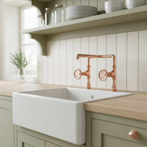 Kitchen sink with copper faucet in a modern kitchen setting