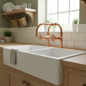 copper tap kitchen sink with copper faucet in a bright kitchen setting
