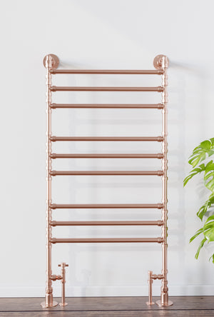 Copper heated towel ladder in bathroom