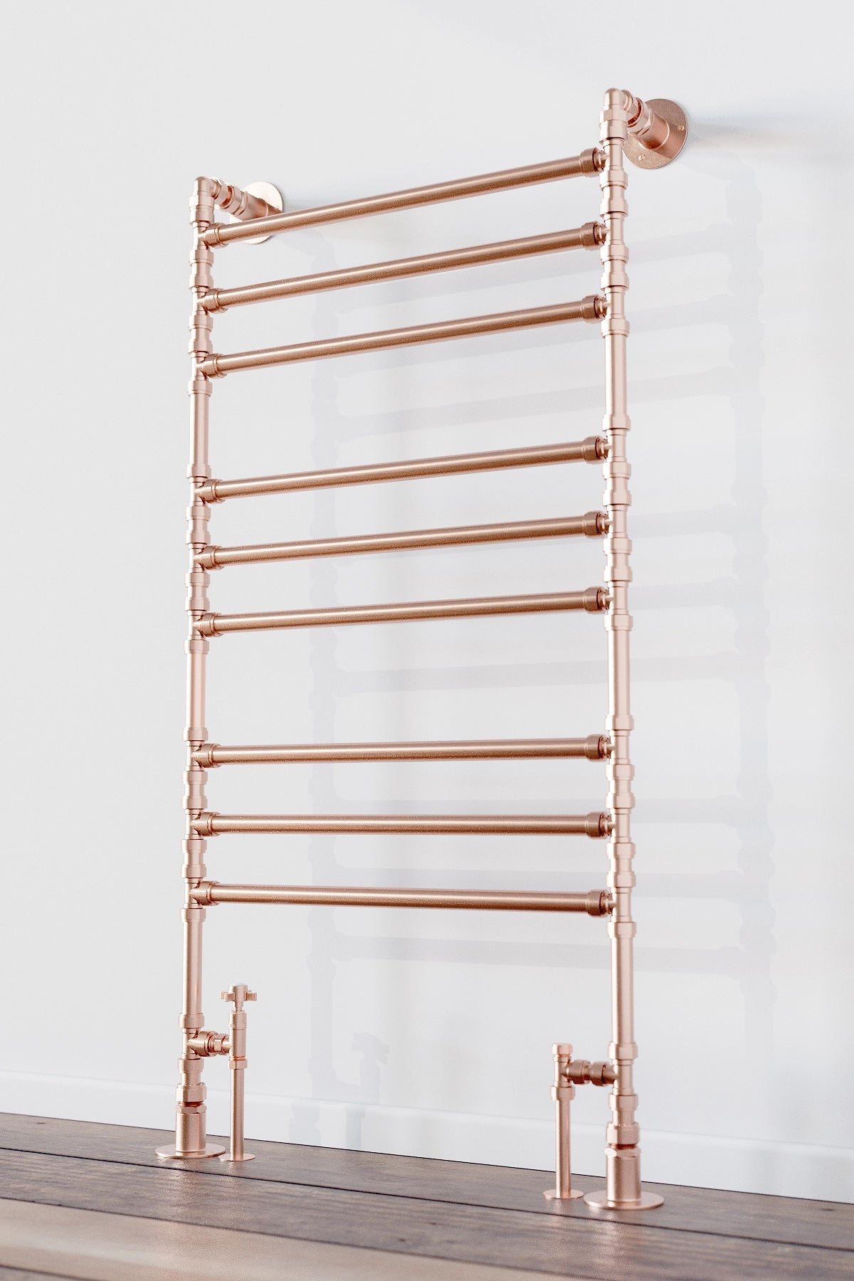 Copper towel ladder in modern bathroom