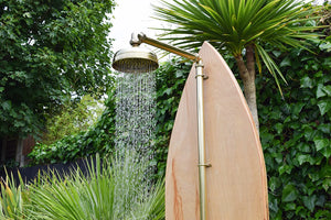 Brass shower against green backdrop