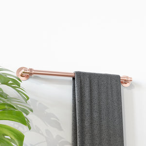 Copper towel rail with towel