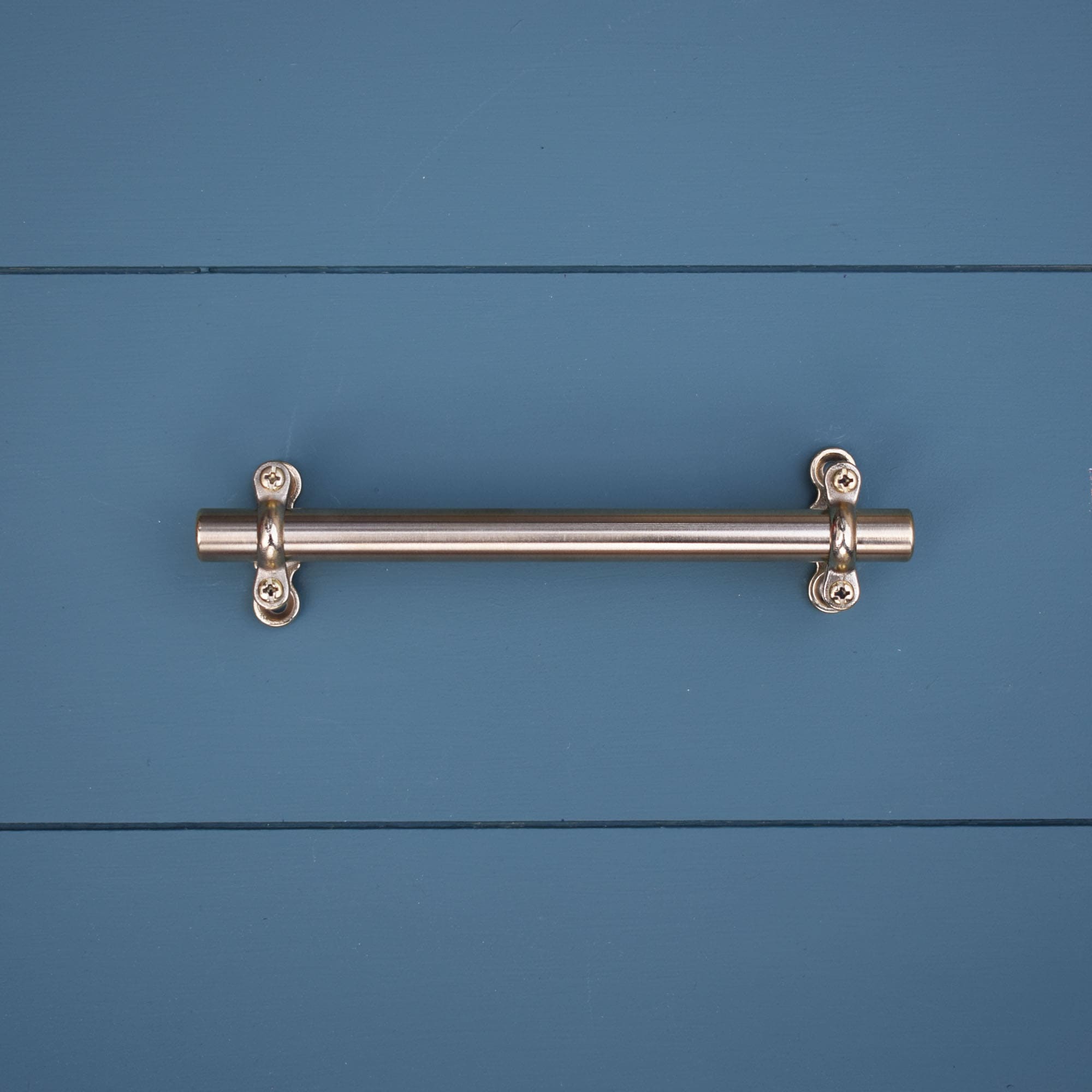 Solid Brass Bracket Pull on blue drawers