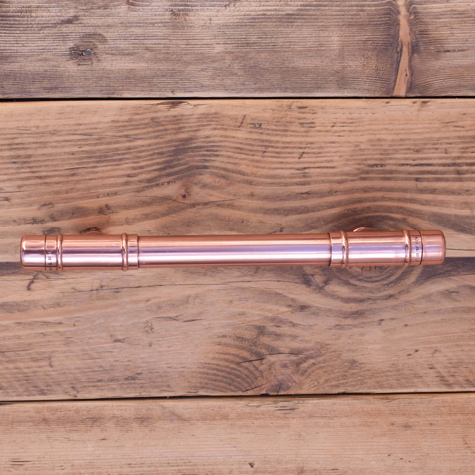 Copper T-Barn Door Pull on Wood Drawers