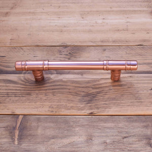 Copper T-Barn Door Pull on Wood Front Angle