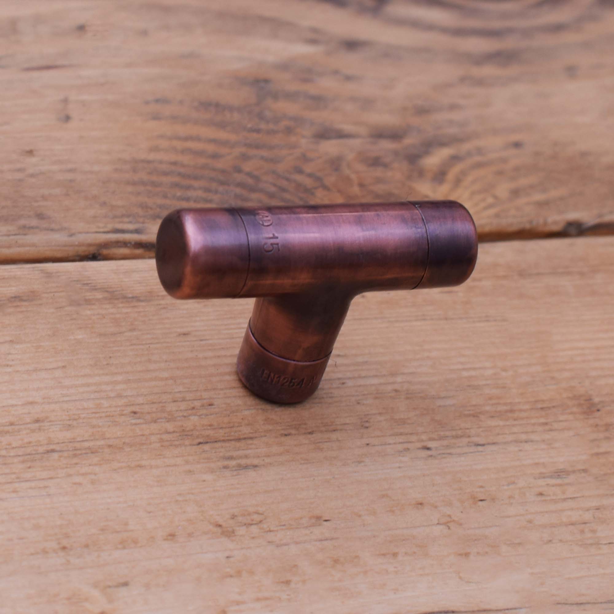 Aged Copper T-Knob on Wooden Drawers