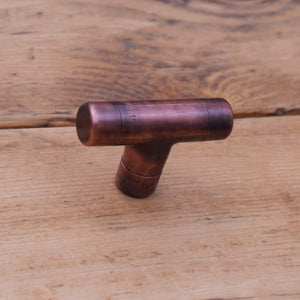 Aged Copper T-Knob on Wooden Drawers