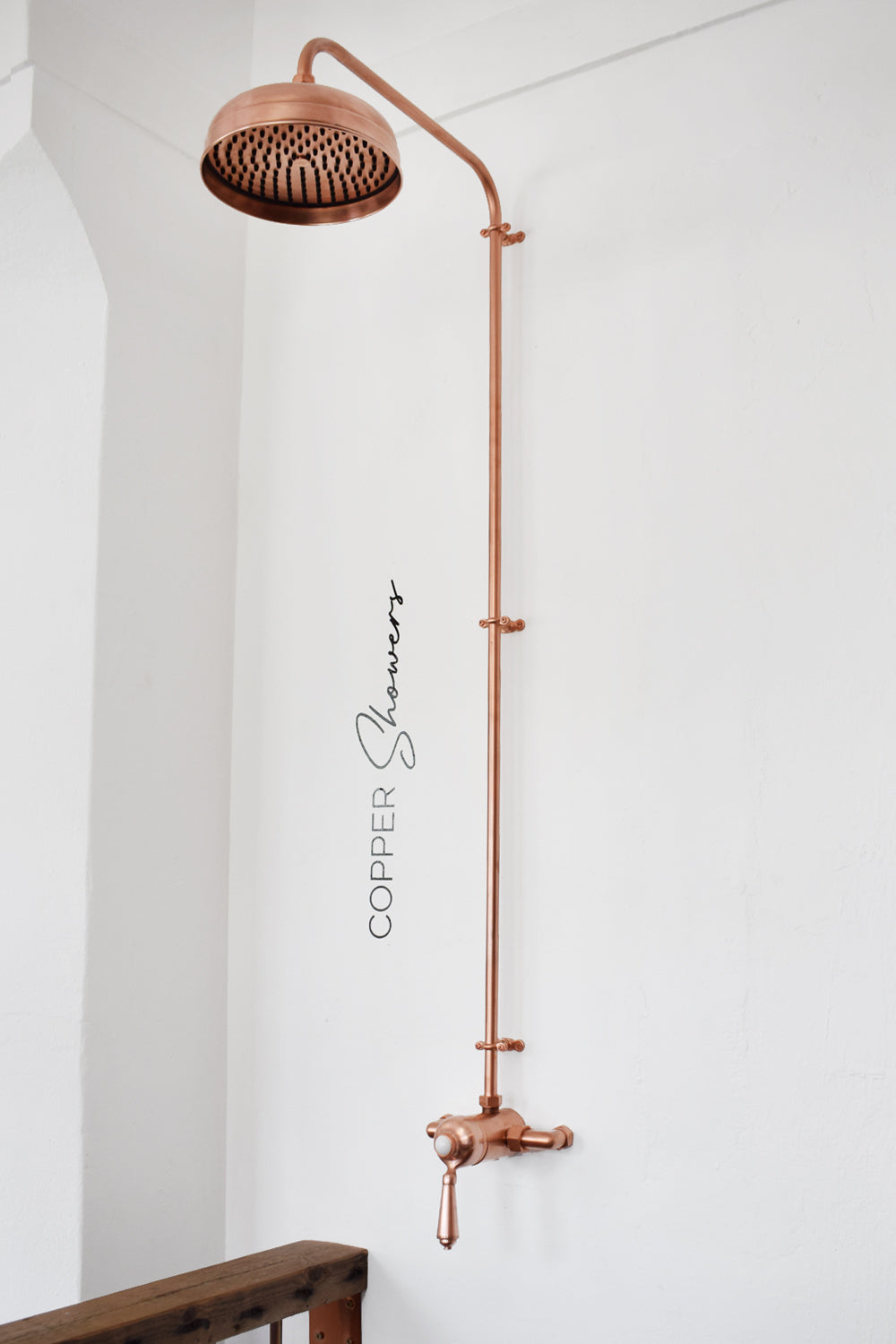 Thermostatic shower system in a copper finish