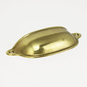 Brass Cup Finger Pull - Flat on white surface