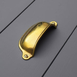 Brass Cup Finger Pull - Polished and fitted to blue kitchen drawers