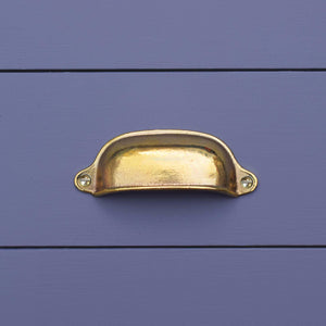 Brass Cup Finger Pull - On blue drawers