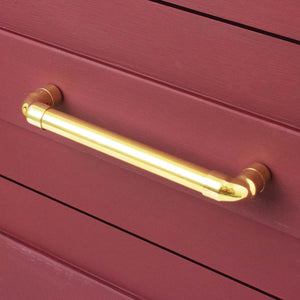Brass U-Shaped Pull Handle on red cabinets