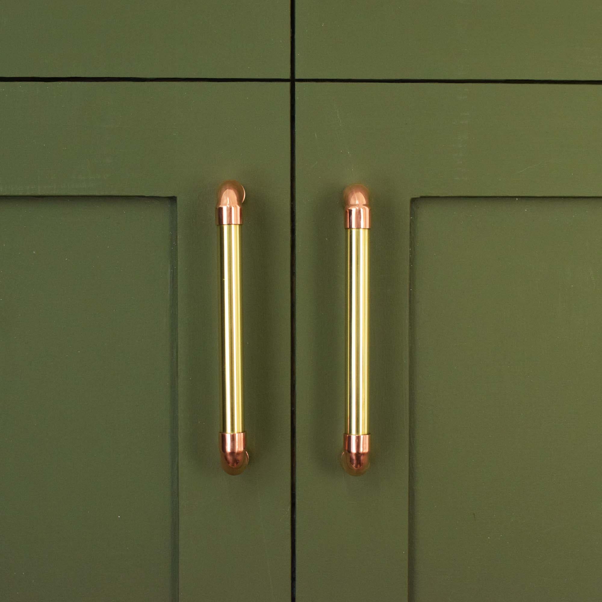 Brass U-Pull Handle with Copper Detail - Front Shot on Green Cabinet