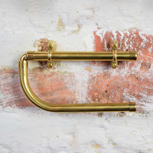 Brass toilet roll holder closeup