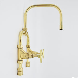 brass tap against white background