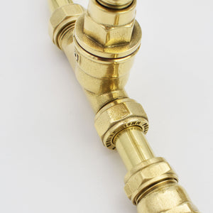 brass faucet close up image