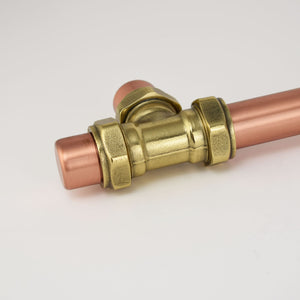 Copper and brass industrial door handle detailed shot