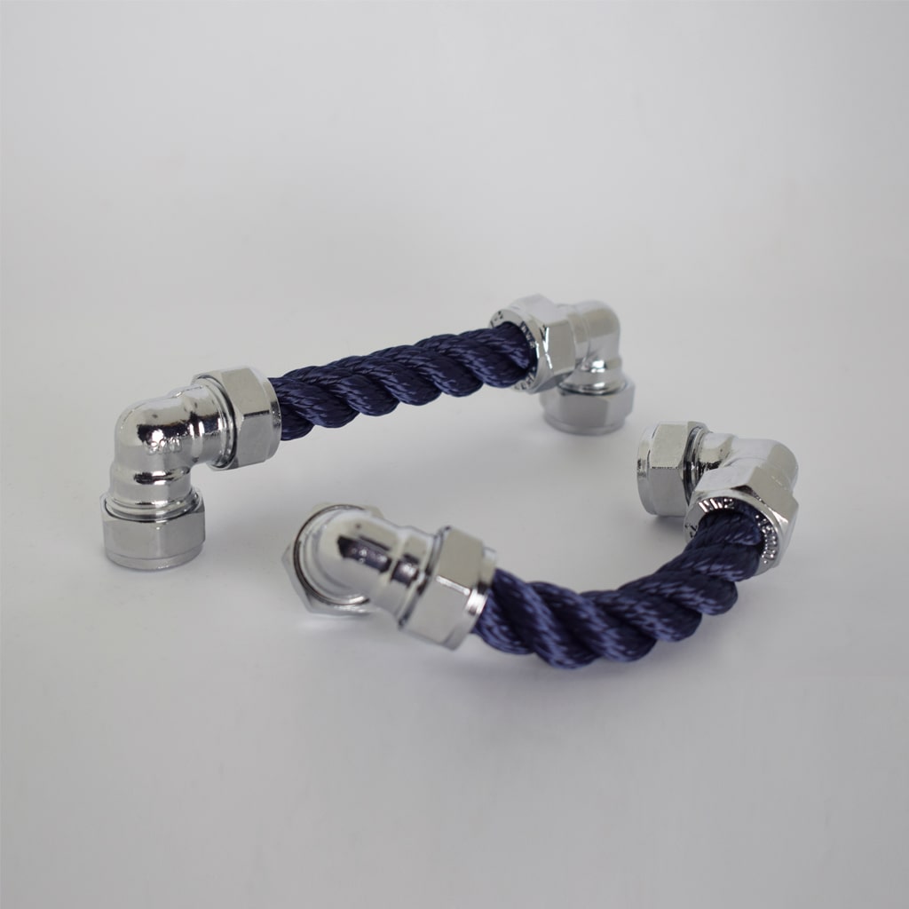 Two chrome and navy rope pulls on white background