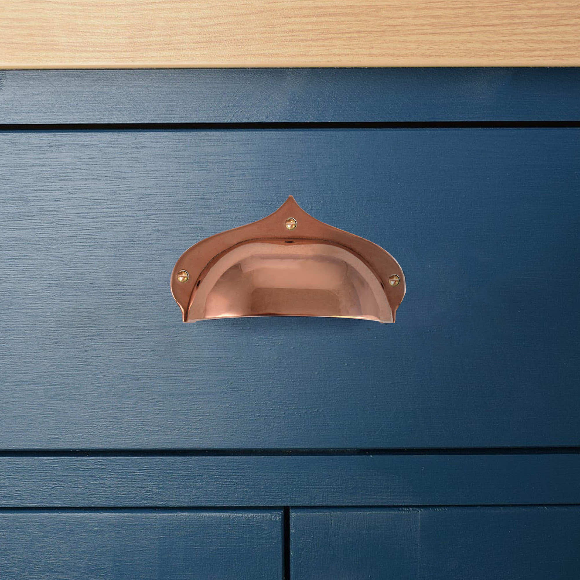 copper drawer pull on drawer