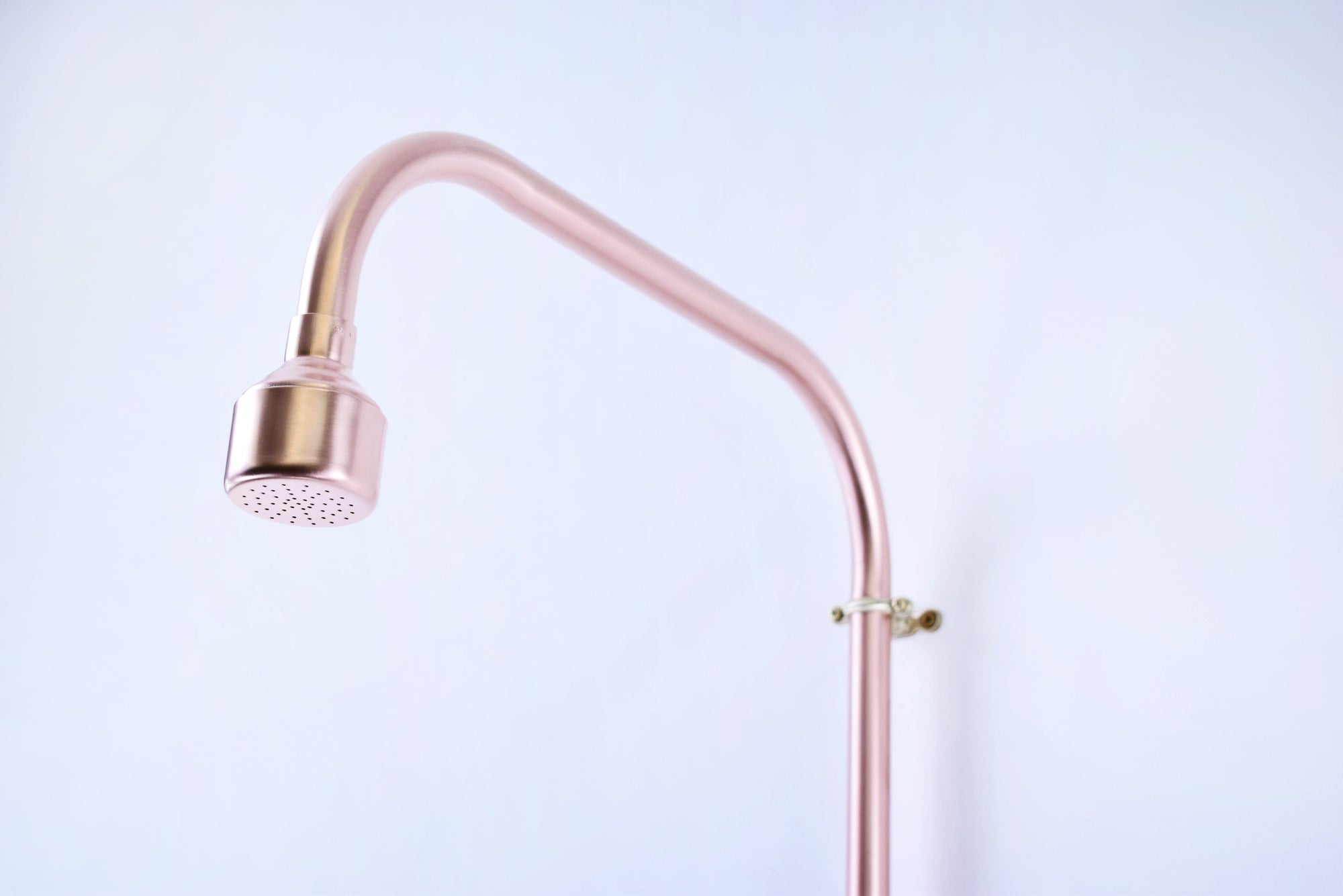 curved copper shower spout perfect for spa resorts