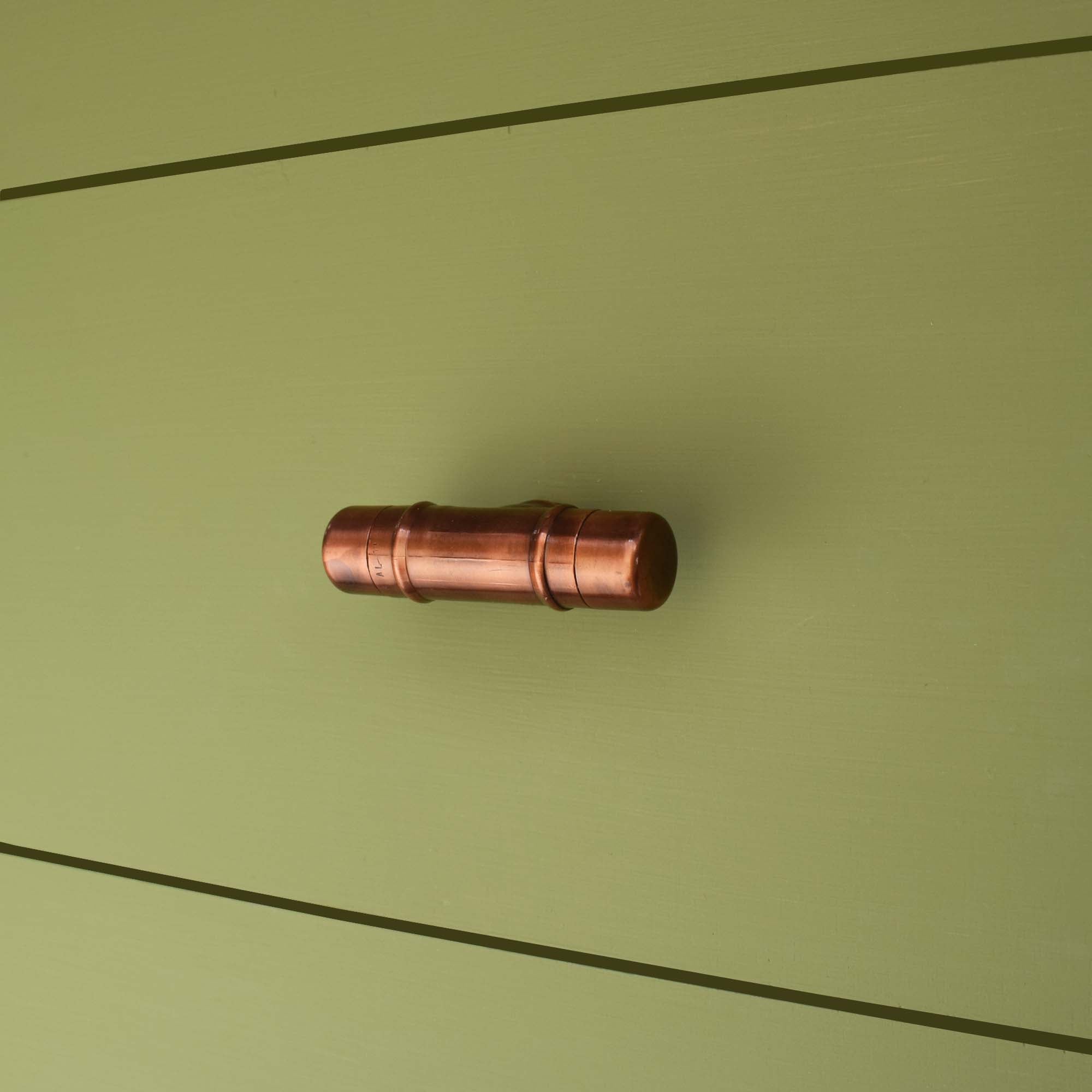 Copper Knob T-shaped - Aged - On Green Drawers